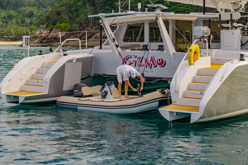 Gizmo Yacht Photos Pics Luxury Morrelli & Melvin 65 custom yacht, 2012, docked with inflatable boat in tropical waters.