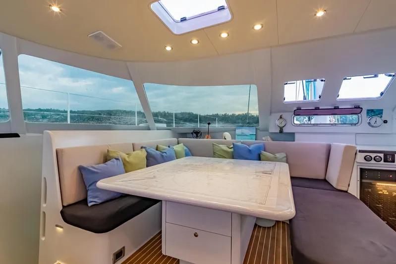 Gizmo Yacht Photos Pics Luxurious interior of 2012 Morrelli & Melvin 65 custom yacht with elegant seating and panoramic windows.