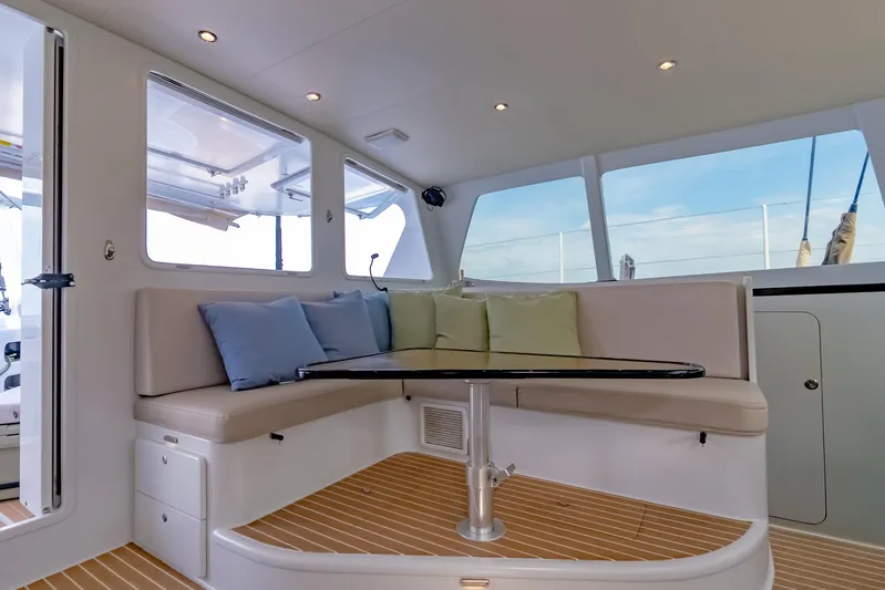 Gizmo Yacht Photos Pics Luxurious interior of 2012 Morrelli & Melvin 65 custom yacht with plush seating and table.
