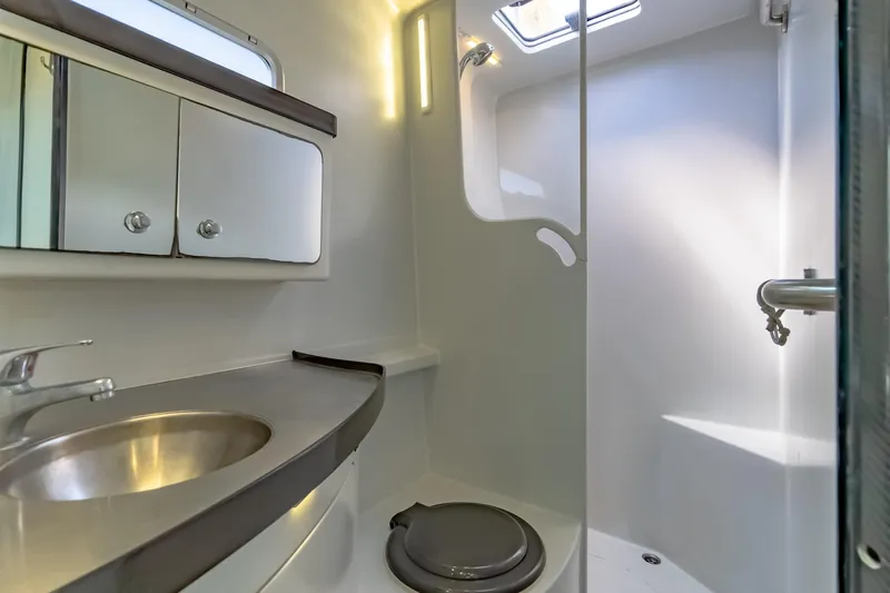 Gizmo Yacht Photos Pics Modern bathroom in 2012 Morrelli & Melvin 65 custom yacht, featuring sleek fixtures and ample lighting.