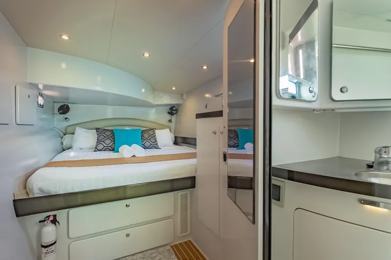 Gizmo Yacht Photos Pics Luxurious interior of 2012 Morrelli & Melvin 65 custom yacht with cozy bed and modern amenities.