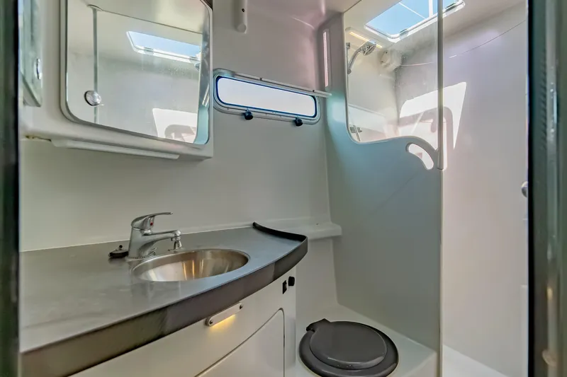 Gizmo Yacht Photos Pics Modern bathroom in 2012 Morrelli & Melvin 65 custom yacht, featuring sleek sink and compact toilet.