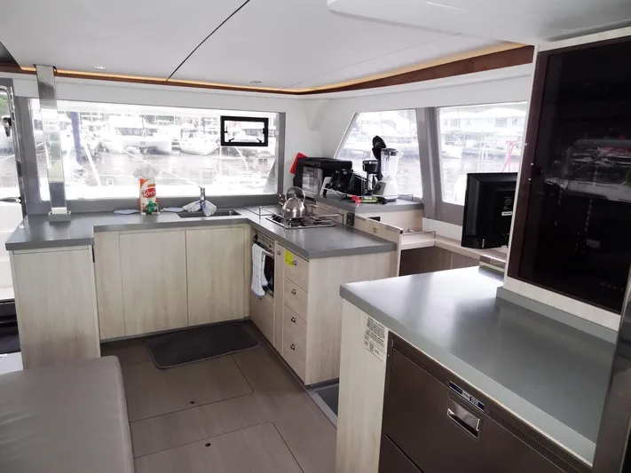 Meow Or Never Yacht Photos Pics Modern kitchen interior on 2020 Leopard 45 yacht with sleek countertops and appliances.