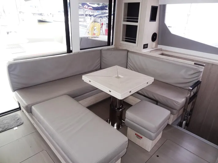 Meow Or Never Yacht Photos Pics Leopard 45 yacht interior, 2020 model, featuring a cozy seating area with a central table.