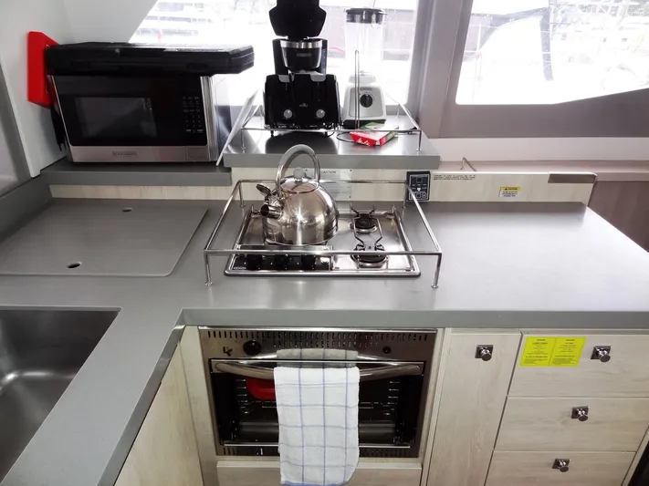 Meow Or Never Yacht Photos Pics Modern kitchen in 2020 Leopard 45 yacht with stove, oven, and appliances.