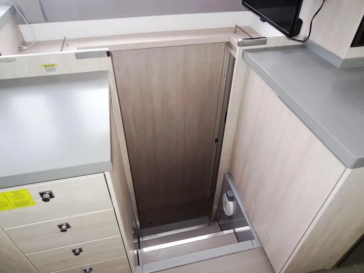 Meow Or Never Yacht Photos Pics Leopard 45 yacht interior, 2020 model, featuring modern cabinetry and sleek design.