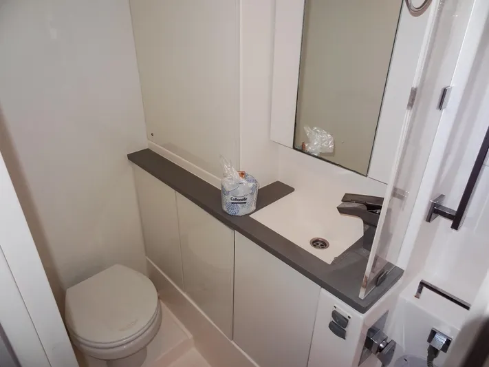 Meow Or Never Yacht Photos Pics Modern bathroom in 2020 Leopard 45 yacht with sink, mirror, and toilet.