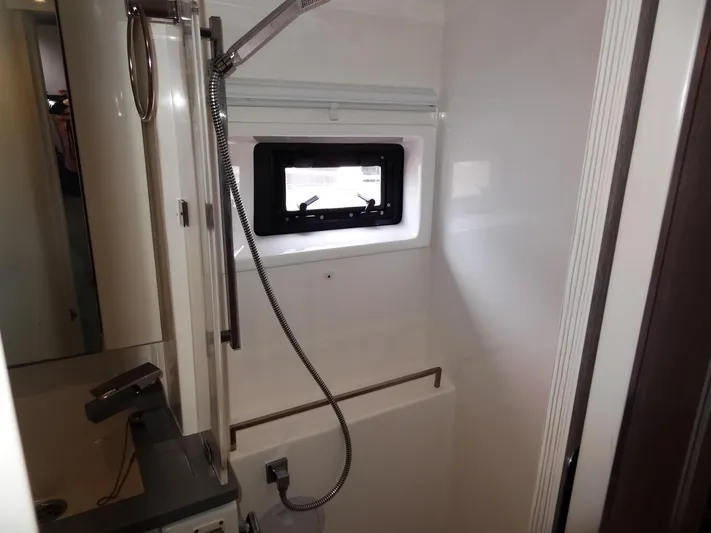 Meow Or Never Yacht Photos Pics Modern shower area in 2020 Leopard 45 yacht with window and sleek fixtures.