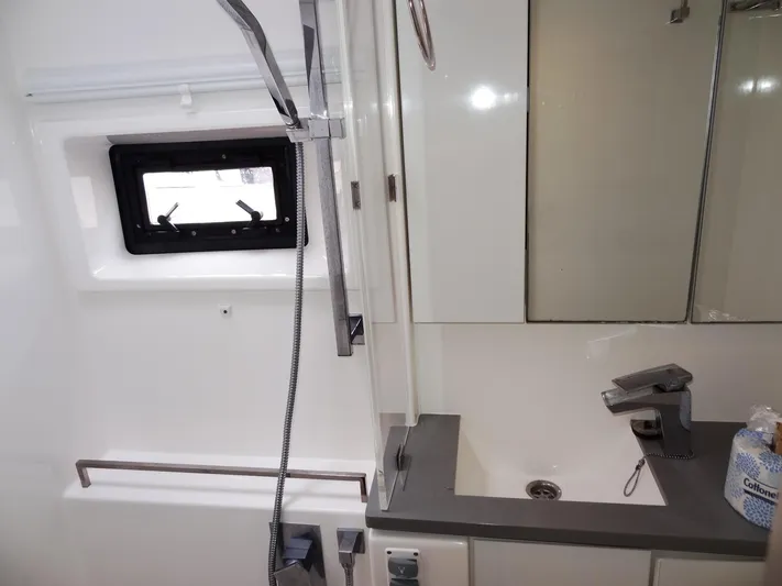 Meow Or Never Yacht Photos Pics Modern bathroom in 2020 Leopard 45 yacht with sleek fixtures and window.