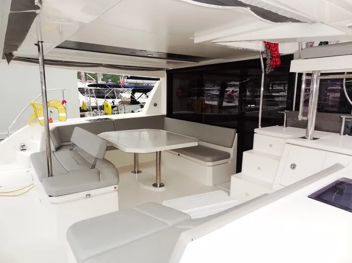 Meow Or Never Yacht Photos Pics Spacious Leopard 45 catamaran interior, featuring modern seating and dining area, 2020 model.