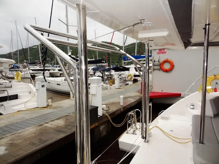 Meow Or Never Yacht Photos Pics Leopard 45 catamaran docked at marina, showcasing sleek design and modern features.