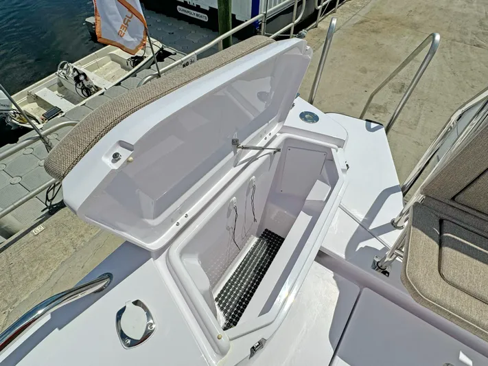  Yacht Photos Pics Open storage compartment on 2025 Axopar 37 Sun Top boat deck.