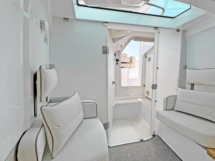  Yacht Photos Pics Interior of 2025 Axopar 37 Sun Top boat with modern seating and skylight.