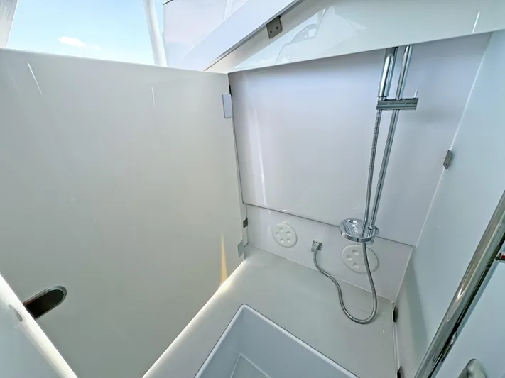  Yacht Photos Pics 2025 Axopar 37 Sun Top boat interior shower area with modern fixtures.