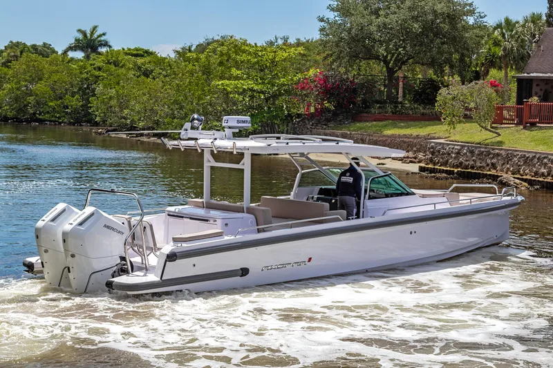  Yacht Photos Pics 2025 Axopar 37 Sun Top boat cruising on a scenic river.