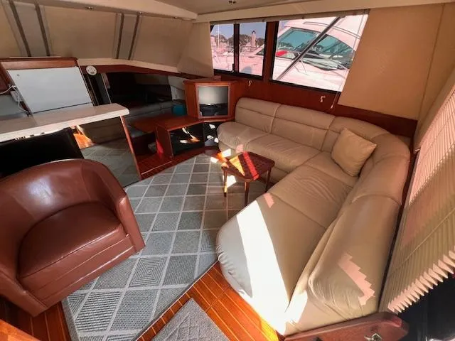  Yacht Photos Pics Luxurious interior of 1993 Viking 45 Convertible yacht with leather seating and modern decor.