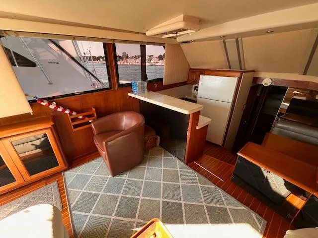  Yacht Photos Pics Interior of 1993 Viking 45 Convertible yacht with wood accents and comfortable seating.