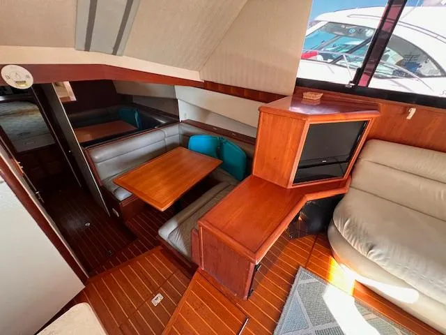  Yacht Photos Pics Interior of 1993 Viking 45 Convertible yacht with wood accents and seating area.