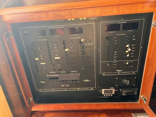  Yacht Photos Pics Electrical panel of a 1993 Viking 45 Convertible boat, featuring switches and controls.