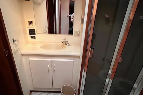  Yacht Photos Pics Bathroom interior of 1993 Viking 45 Convertible yacht with sink and shower.