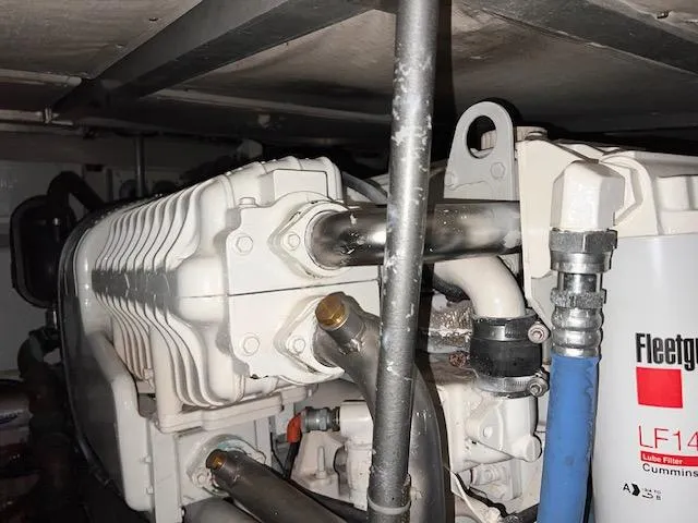  Yacht Photos Pics Engine room of 1993 Viking 45 Convertible boat, featuring mechanical components and pipes.