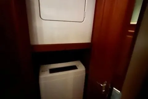  Yacht Photos Pics Laundry area inside 1993 Viking 45 Convertible yacht with washer and dryer.
