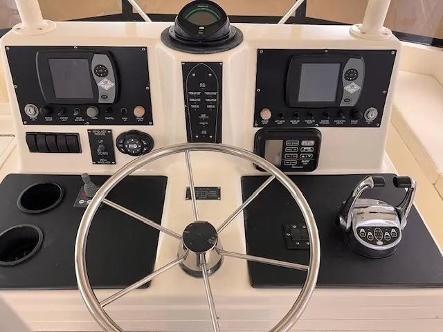  Yacht Photos Pics 1993 Viking 45 Convertible helm with dual displays and steering wheel.