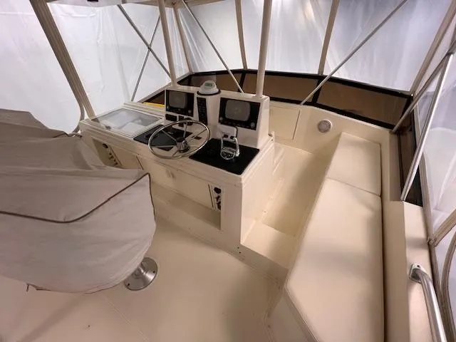  Yacht Photos Pics 1993 Viking 45 Convertible boat helm with dual controls and seating area.