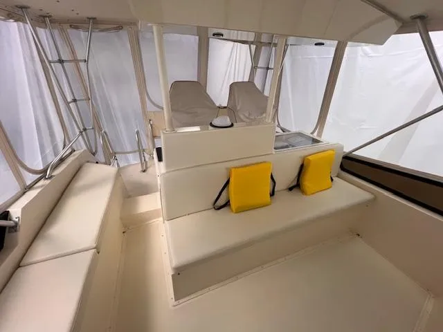  Yacht Photos Pics 1993 Viking 45 Convertible boat interior with seating and yellow life jackets.
