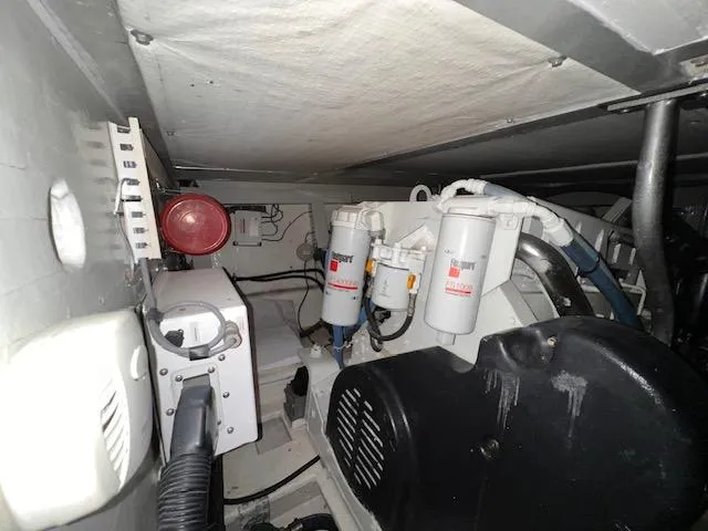  Yacht Photos Pics Engine room of 1993 Viking 45 Convertible boat with filters and machinery.