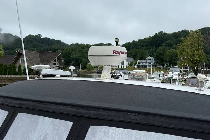 Houligan's Haven Yacht Photos Pics 2004 Cruisers 370 Express yacht docked at marina with Raymarine radar.