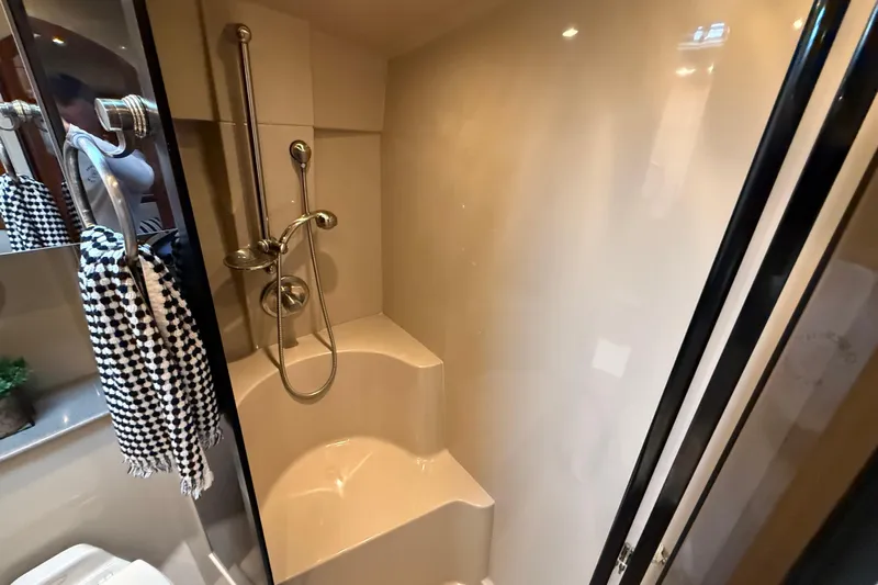 Houligan's Haven Yacht Photos Pics 2004 Cruisers 370 Express yacht bathroom with shower and checkered towel.