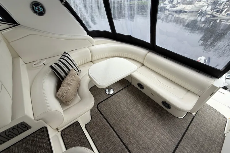 Houligan's Haven Yacht Photos Pics Luxurious 2004 Cruisers 370 Express yacht interior with plush seating and elegant decor.