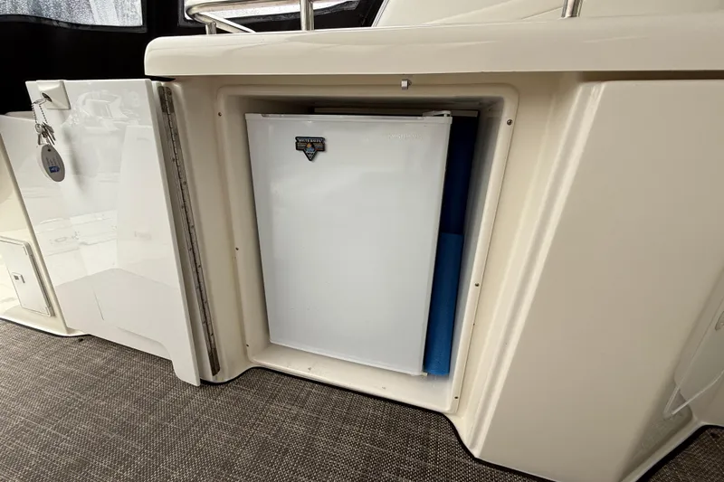 Houligan's Haven Yacht Photos Pics 2004 Cruisers 370 Express yacht interior with built-in refrigerator.