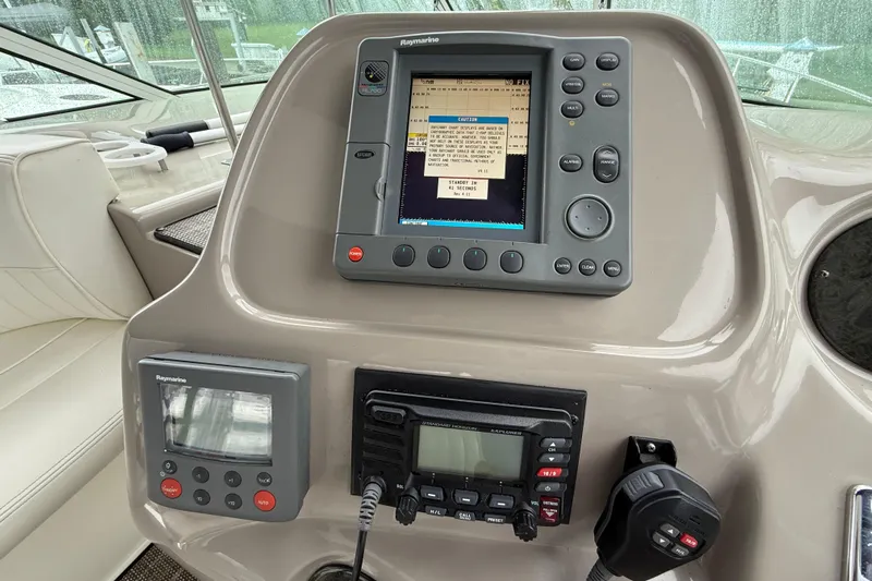 Houligan's Haven Yacht Photos Pics Control panel of a 2004 Cruisers 370 Express boat with navigation equipment.