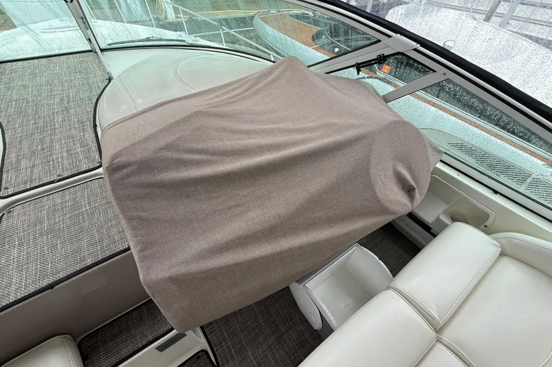 Houligan's Haven Yacht Photos Pics 2004 Cruisers 370 Express boat interior with covered helm and seating area.