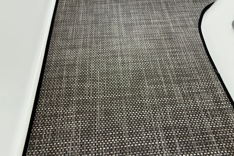 Houligan's Haven Yacht Photos Pics Woven floor mat on 2004 Cruisers 370 Express boat, featuring a textured pattern.