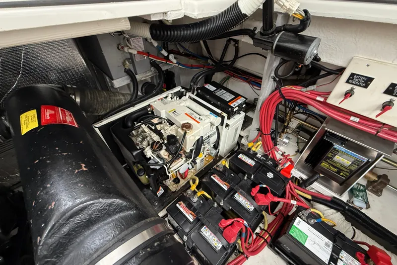 Houligan's Haven Yacht Photos Pics Engine room of 2004 Cruisers 370 Express with batteries and wiring.
