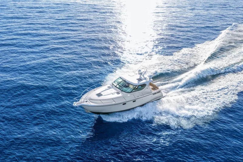  Yacht Photos Pics 2008 Tiara Yachts 4300 Sovran cruising on open blue ocean waters.