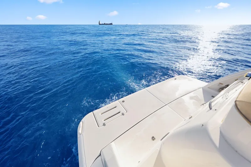  Yacht Photos Pics 2008 Tiara Yachts 4300 Sovran on open sea, sunny day, distant ship visible.