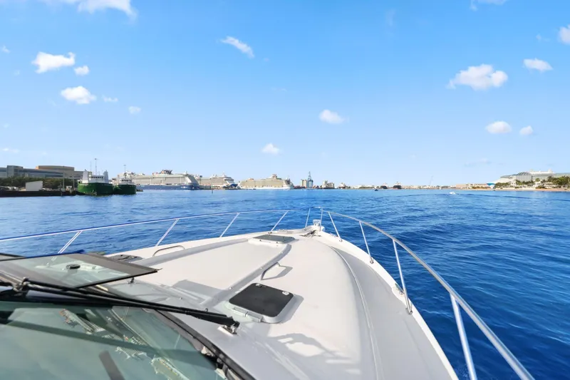  Yacht Photos Pics Bow view of 2008 Tiara Yachts 4300 Sovran cruising in a sunny harbor.