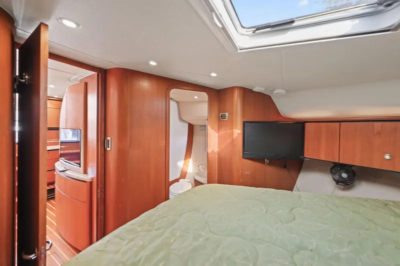  Yacht Photos Pics 2008 Tiara Yachts 4300 Sovran interior cabin with wood finish and modern amenities.
