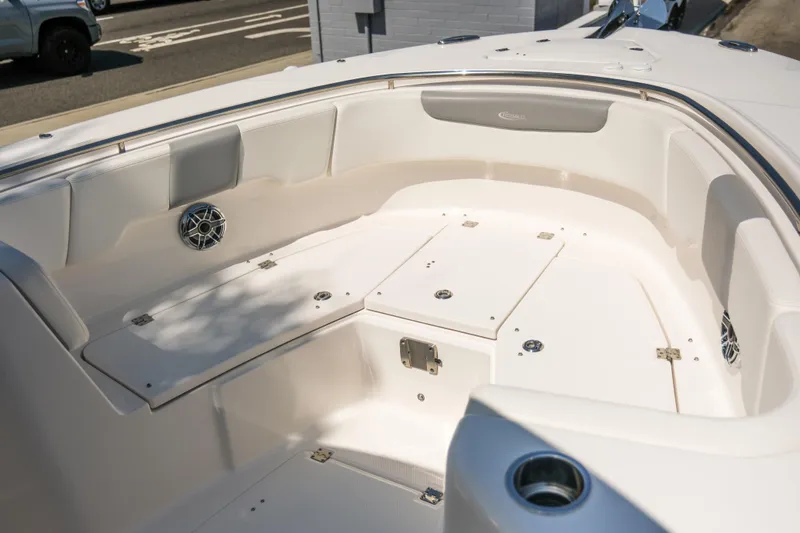 Elixir Yacht Photos Pics 2023 Robalo R302 Center Console boat interior with seating and storage compartments.