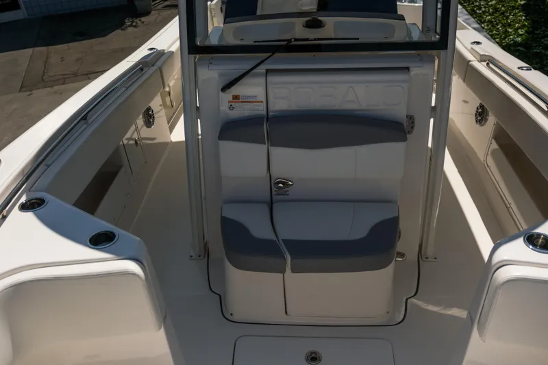 Elixir Yacht Photos Pics 2023 Robalo R302 Center Console boat interior with seating and storage compartments.