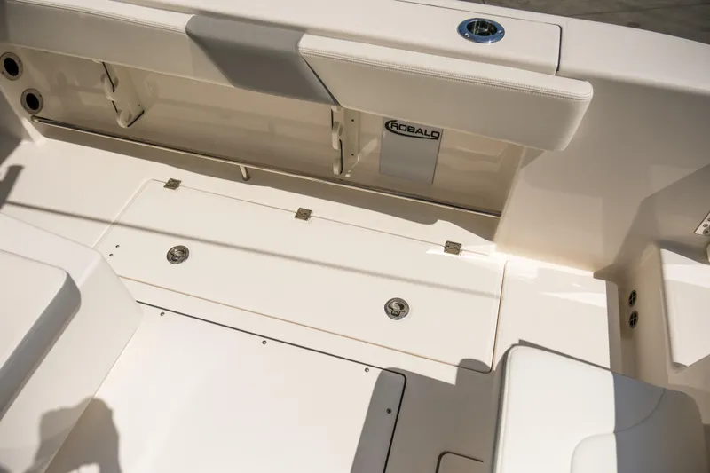 Elixir Yacht Photos Pics 2023 Robalo R302 Center Console boat interior with seating and storage compartments.