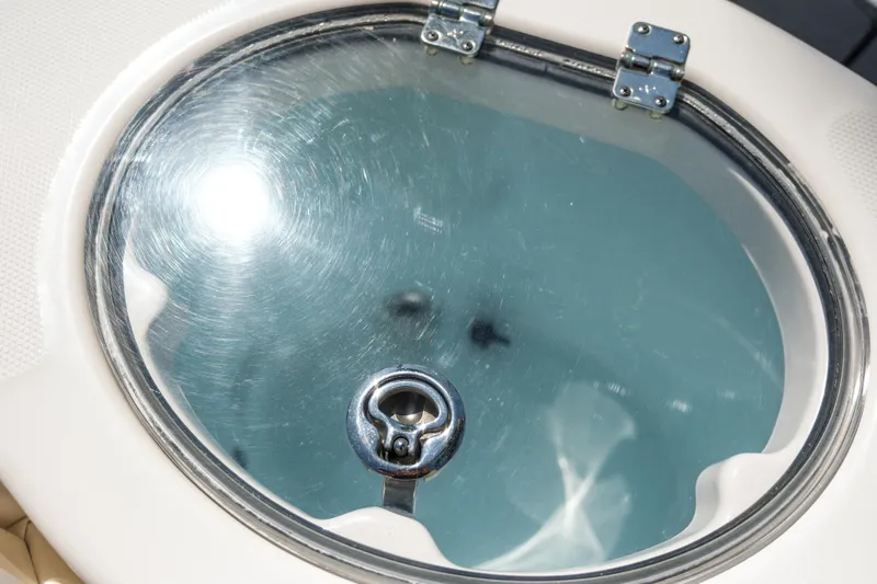 Elixir Yacht Photos Pics 2023 Robalo R302 Center Console livewell with secure latch and clear lid.