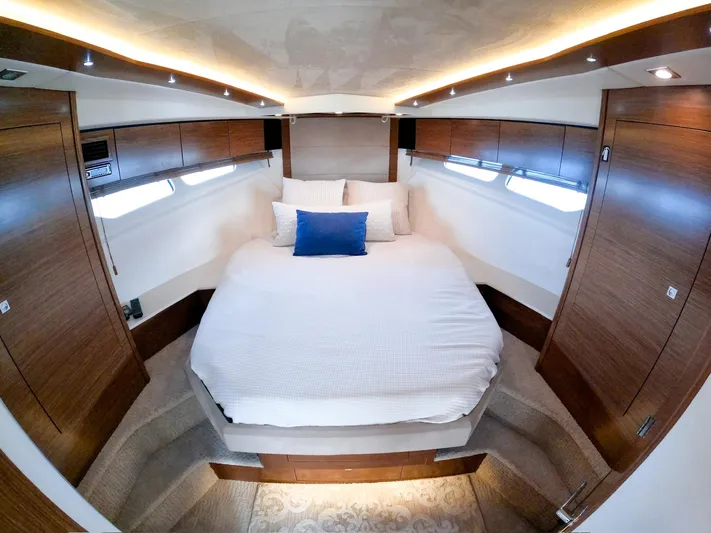  Yacht Photos Pics Luxurious bedroom interior of 2016 Cruisers Yachts Cantius 45 with modern wood finishes.