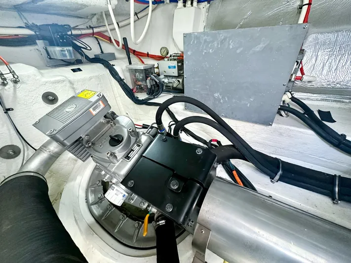  Yacht Photos Pics Engine room of 2016 Cruisers Yachts Cantius 45, showcasing mechanical components and wiring.