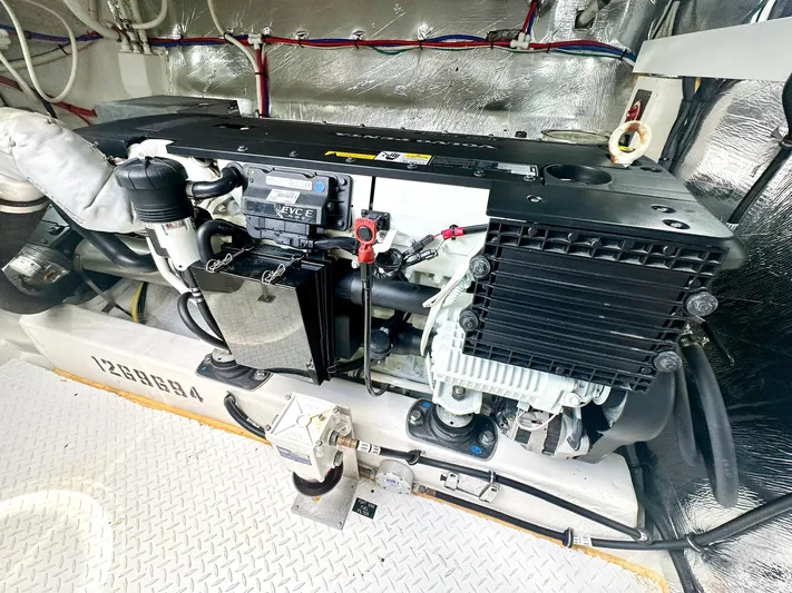  Yacht Photos Pics Engine room of 2016 Cruisers Yachts Cantius 45, showcasing detailed mechanical components.