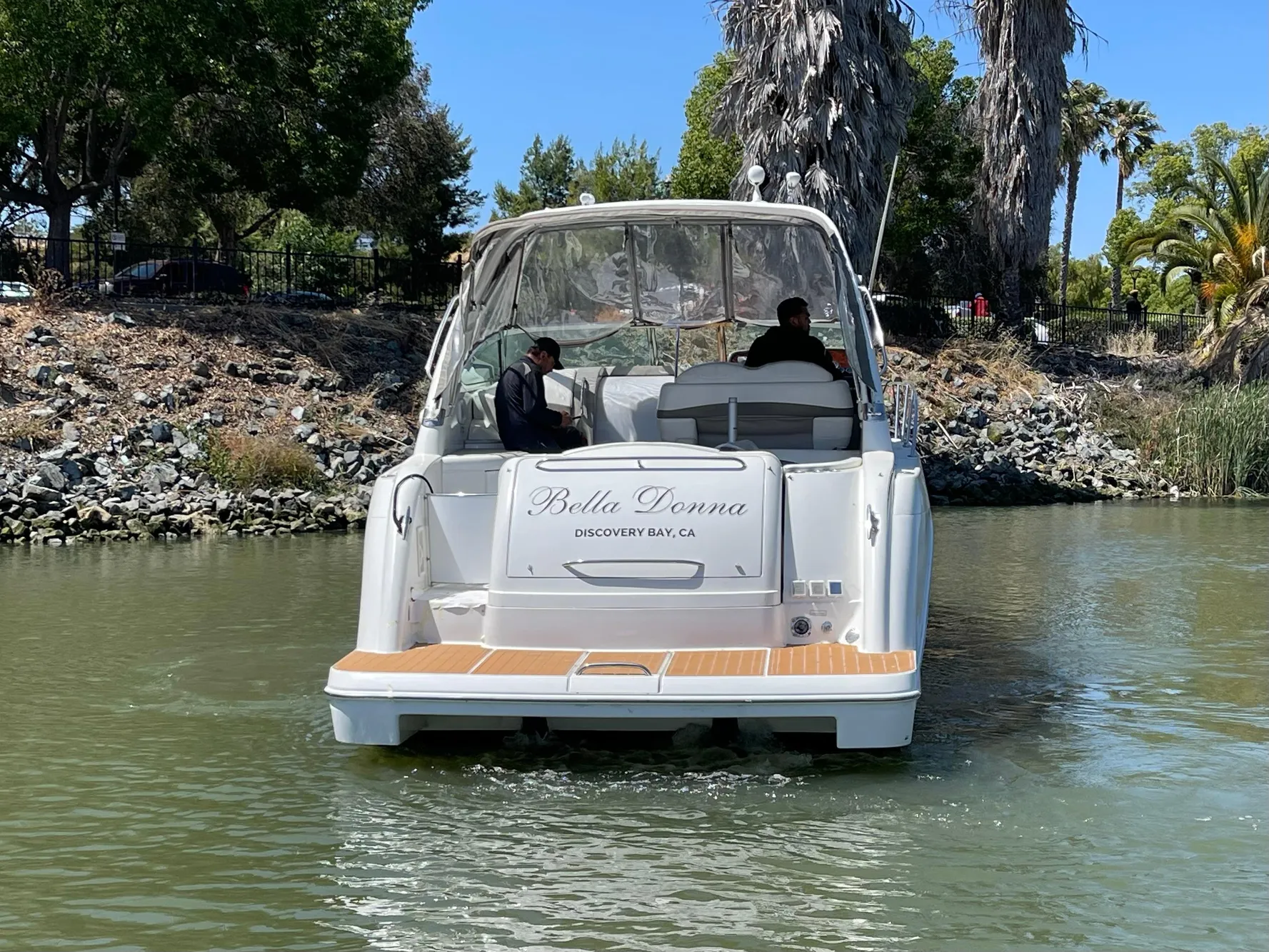 2003 Formula 37 PC boat named "Bella Donna" cruising in a scenic waterway.